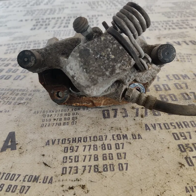 Тормозний супорт Mazda 3 BK (03-09) зад. лів. OEM 2008814LBO
