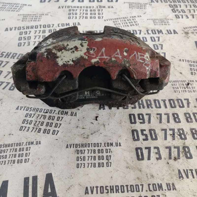 Тормозний супорт передній лівий Mazda 3 BK (03-09)